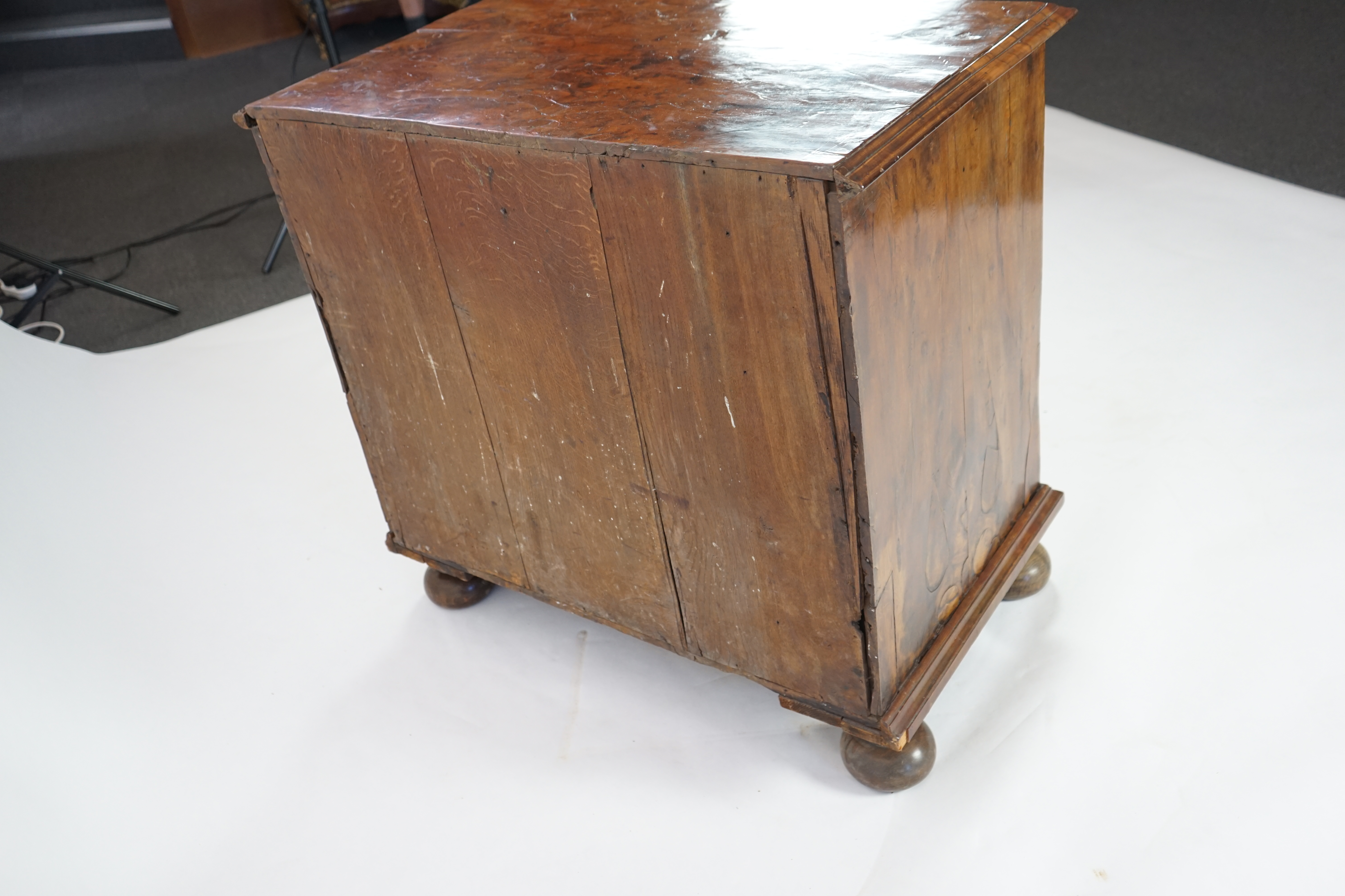 An early 18th century and later yew wood veneered oak chest